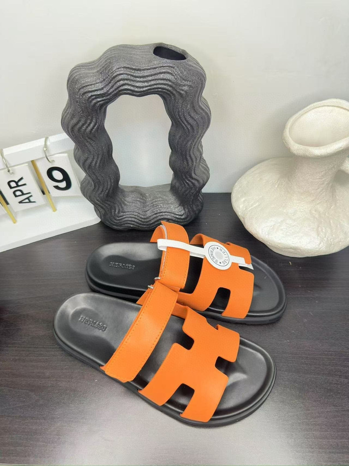 Hermès Orange Interwoven Slide Sandals - Orange and Black