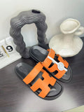 Hermès Orange Interwoven Slide Sandals - Orange and Black